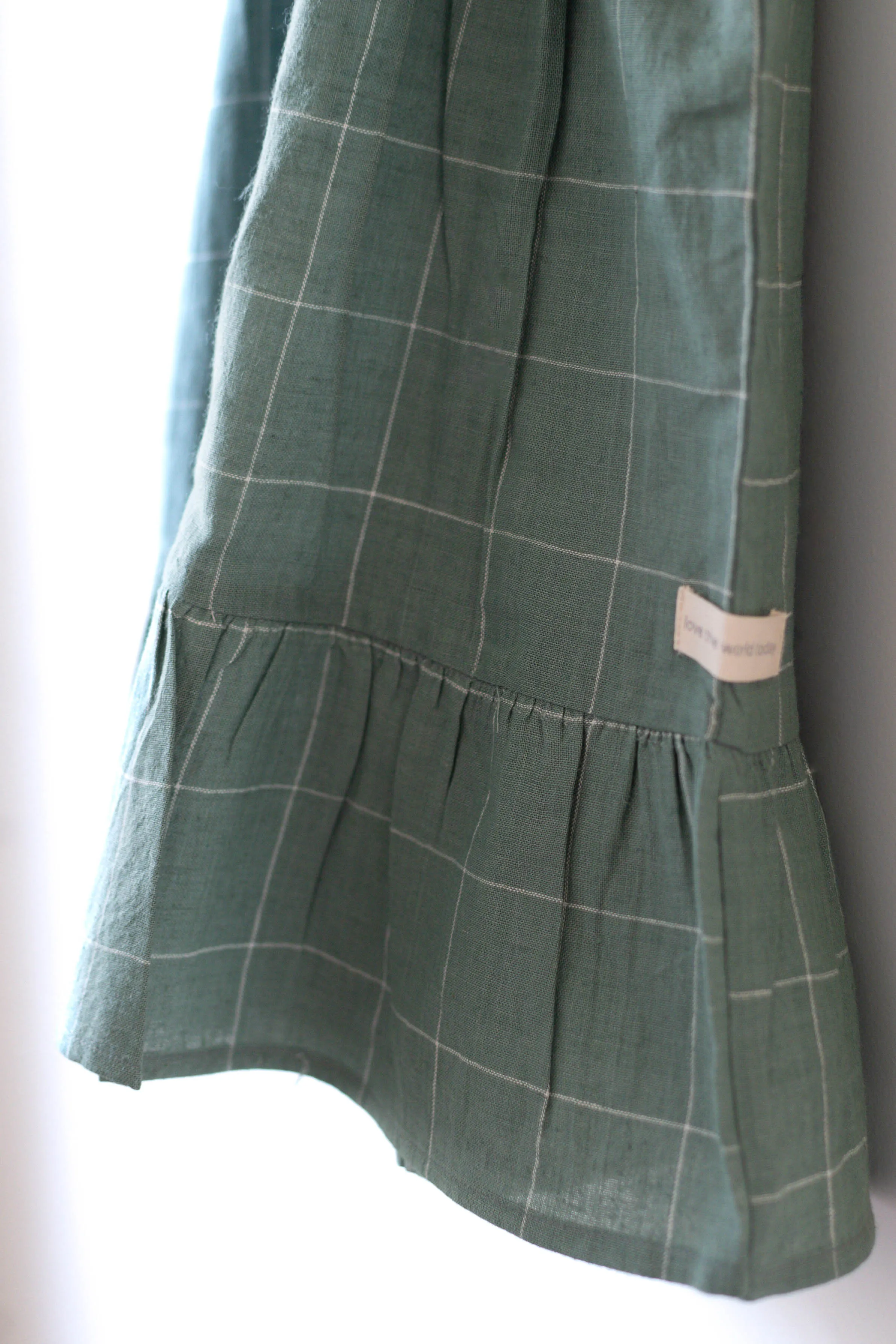 Endless possibilities’ pinafore dress / skirt in teal handwoven cotton checks