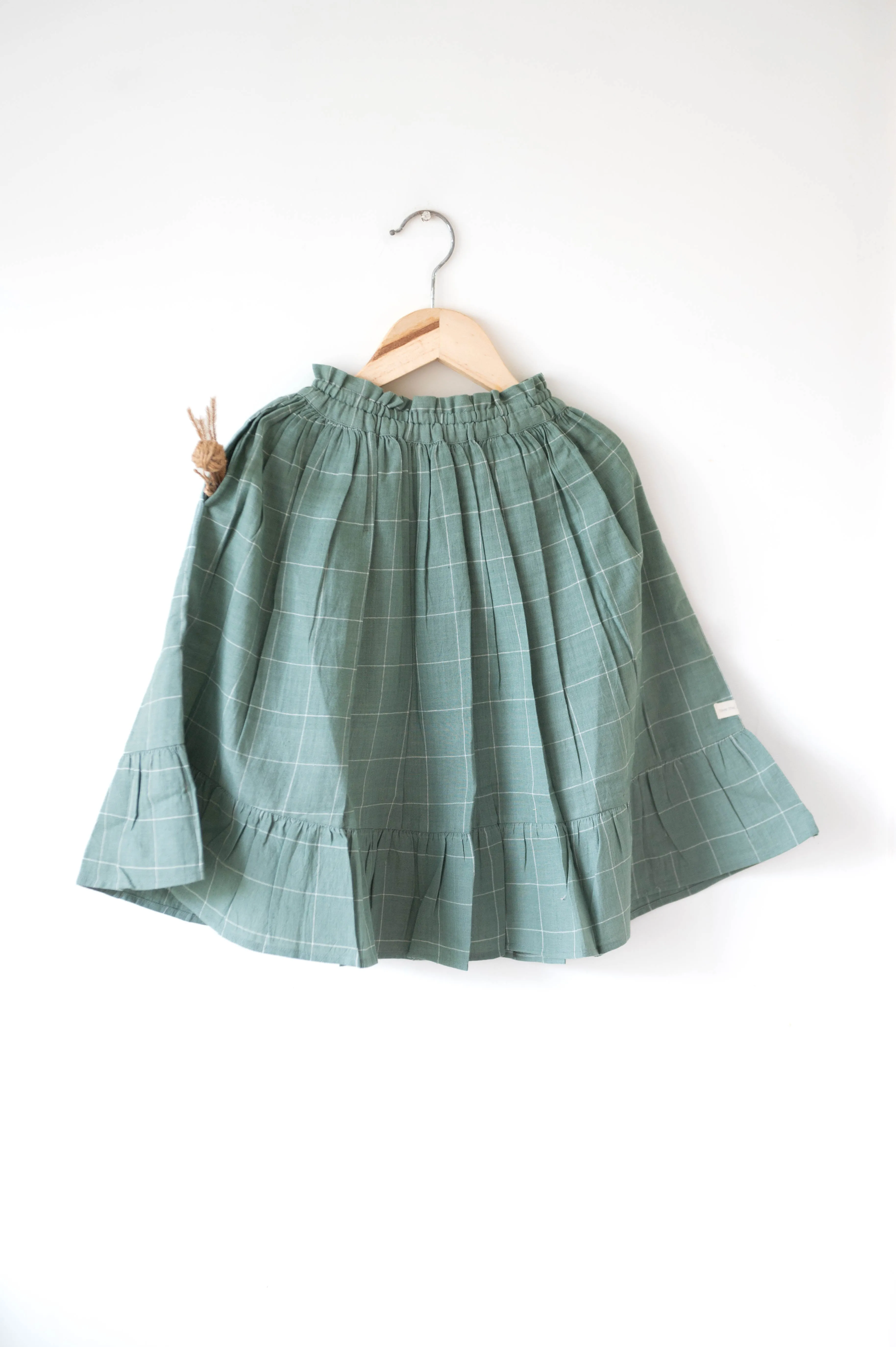 Endless possibilities’ pinafore dress / skirt in teal handwoven cotton checks